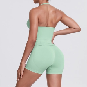 Detail of mint green seamless ribbed yoga set showing high-waisted shorts and texture
