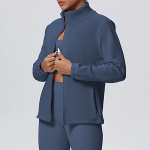 Detailed view of women's thermal running jacket with a stand collar and full-zip design