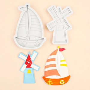 DIY silicone mold featuring sailboat and windmill shapes for fondant and clay ornaments