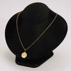 Golden stainless steel necklace with engraved Together Thankful pendant on display