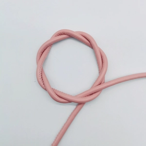 Detail of pink 6mm round leather cord with stitching and lychee grain texture for DIY bags