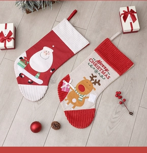 Detailed view of high-quality Christmas stockings with Santa and Reindeer embroidery