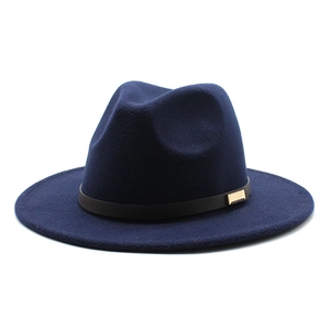 Detailed view of navy wool fedora hat featuring a black leather band and gold buckle