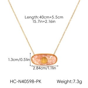 Detail showing dimensions of golden necklace with pink shell pendant and shell motif