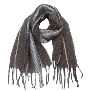 Detailed close-up of knitted scarf with geometric stripes and decorative fringe tassels