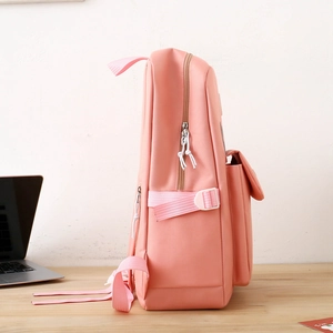Side view of large pink school backpack showing side pocket and adjustable straps
