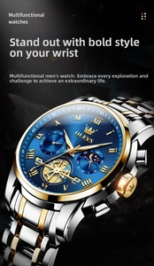 Macro detail of OLEVS men's watch featuring a moon phase display and blue sunray dial