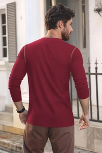 Detailed back view of a slim fit men's burgundy long sleeve polo shirt in street setting