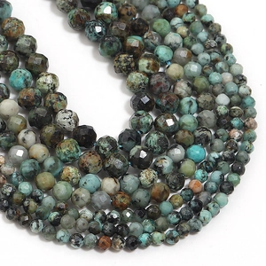 Macro shot of faceted natural stone beads in blue-green and brown for DIY jewelry