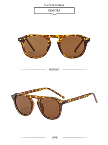 Close-up of tortoise shell sunglasses with double metal bridge and tea lenses