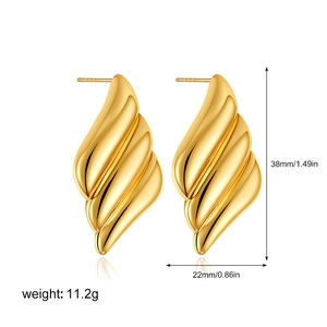 Detail view of 18K gold-plated wing earrings with dimensions 38mm x 22mm on white background
