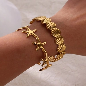 Golden starfish and scallop textured cuff bracelets for women with a matte satin finish