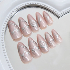 Metallic flame nail tips in pearlescent pink and silver with chic almond shape