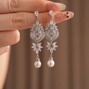 Elegant silver heart leaf earrings with sparkling cubic zirconia and white pearl drops