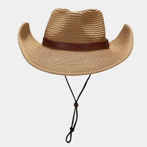 Classic Western straw cowboy hat with leather band and wind rope on grey background