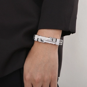 Detailed close-up of men's stainless steel Byzantine chain with mechanical gear clasp