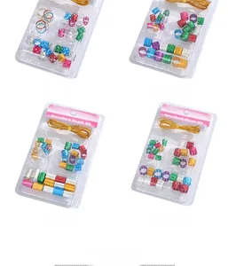 Detailed view of four colorful dreadlock bead sets with gold string in blister packaging