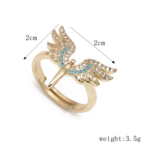 Adjustable gold angel wing ring for women featuring turquoise and white cubic zirconia