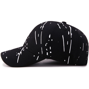 Black baseball cap featuring white graffiti paint splatter print for outdoor sports