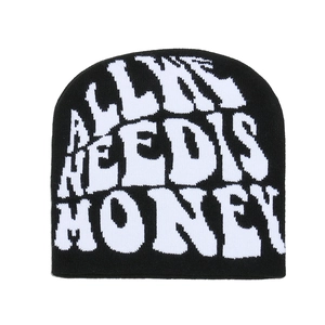 Detail of Y2K winter knit beanie featuring white jacquard text on black warm fabric
