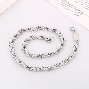 Detail of 7mm silver rope chain necklace with a blank rectangular tag for custom engraving