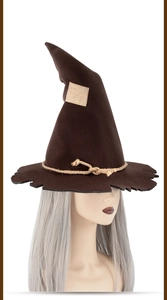Detail of a brown witch hat with rustic patchwork and thick rope texture for Halloween