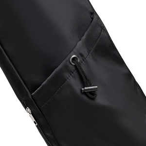 Close-up of black nylon yoga bag with drawstring closure and durable fabric texture