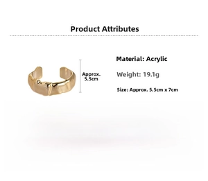 Macro view of gold-tone acrylic open bangle with crushed texture finish and 7cm dimension