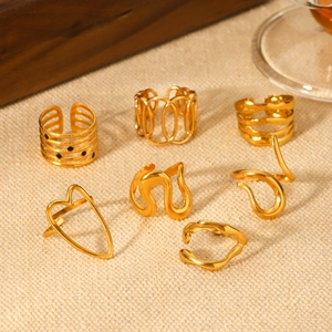 Detail view of 7-piece set gold stainless steel rings with heart and wave designs