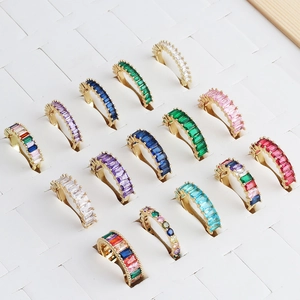 Golden minimalist rings with colorful cubic zirconia in square and round cuts