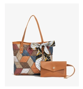 Quilted tote bag set with brown clutch and printed silk scarf on the handle