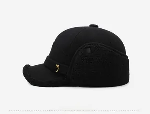 Detail view of winter baseball cap featuring warm fleece earflaps and metallic NY side logo