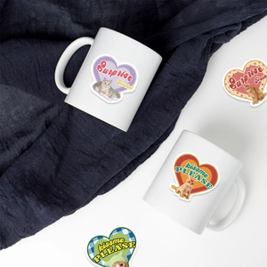 Retro cat and heart stickers on white ceramic mugs set with creative surprise packet design