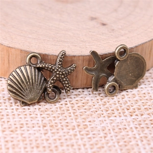 Antique bronze starfish and shell connectors for DIY jewelry making on woven fabric