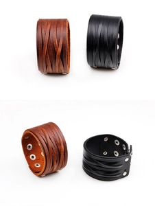 Detail view of brown and black wide leather cuff bracelets with metal snap closure