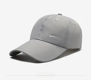 Detail view of quick-dry baseball cap featuring a long brim and SIDE SPORTS embroidery