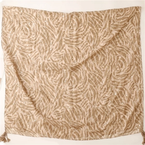 Detail of champagne cotton linen scarf with gold foil zebra print and fringe edges