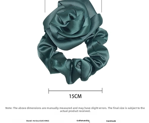 Detail view of 15cm handmade dark green satin rose scrunchie with luxury silk texture