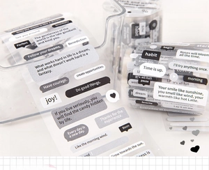 Detailed view of clear PET stickers with minimalist black and white text for DIY journaling