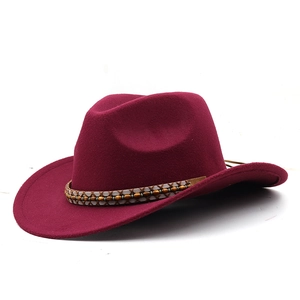 Close-up of wine red fedora hat with braided band and decorative brown beads