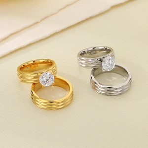 Macro shot of 18K gold and silver plated rings with zircon stones and rhombic textures