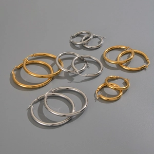 Detailed set of gold and silver stainless steel hoop earrings in various sizes and diameters