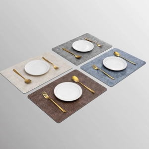 Waterproof leather placemats with woven texture in four colors and gold cutlery