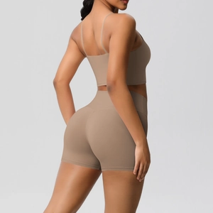 Close-up of taupe ribbed sports bra and high-waisted shorts showing seamless texture
