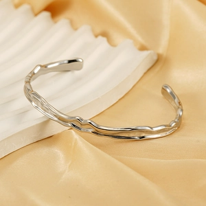 Silver irregular lava texture open bangle in stainless steel with metallic finish