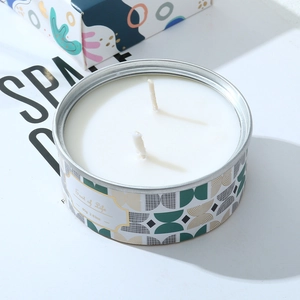 Detail of 80g tin scented candle with double cotton wick and geometric label design