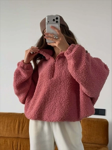 Pink sherpa fleece sweatshirt with high-neck half zipper and cozy oversized fit for winter