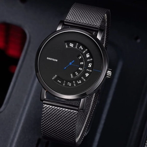 Detail of GADYSON black mesh men's watch with blue second hand and rotating hour disc