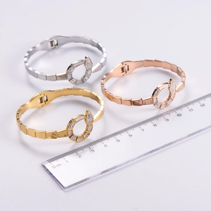 Detailed comparison of three snake-shaped bangles in silver, gold, and rose gold finish
