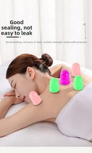 Close-up of colorful silicone massage suction cups on user back for therapy